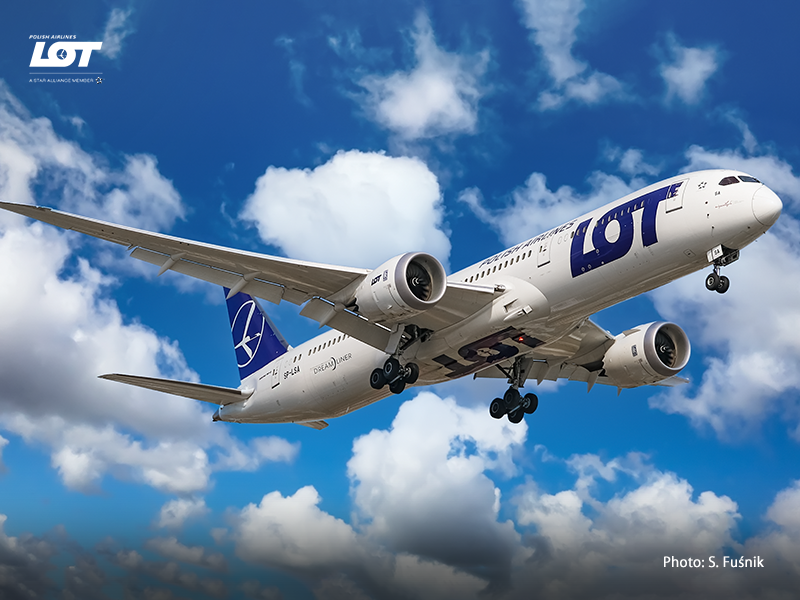 Passenger airplane against a sky with clouds.